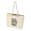 A cream beach tote bag with rope handles and a decorative design. It features a logo on one side.