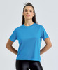 A blue athletic t-shirt is displayed on a model, featuring a relaxed fit and a simple design.