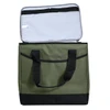 A green and black cooler bag with a spacious interior and two sturdy handles. It includes a light-coloured lining.