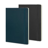A large Moleskine Classic Soft Cover Notebook in dark green and black, featuring a spine and elastic closure.