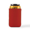 A red stubby cooler holding a can, designed to keep drinks cold. It features a simple, smooth design.