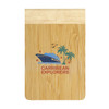 A bamboo notebook with a natural finish, featuring a logo and tropical design with palm trees and a boat.