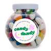 A glass jar filled with assorted colored mini jelly beans, featuring a label that says "candy that's always dandy."