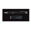 A pen and a flash drive are displayed in a sleek black gift set.