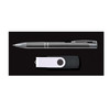 A pen and a USB flash drive arranged on a black background, part of the Cove Gift Set.