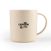 A cream-coloured mug with a textured finish and a logo. It has a curved handle and a round body.