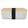 A lunch box featuring a natural bamboo lid and a textured white base, secured with a black elastic strap.