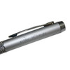 A silver and textured metal ballpoint pen with a clip and branding on the barrel.