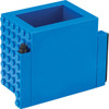 A blue pen pot designed with a Lego-like texture, featuring a compartment for a pen on the side.
