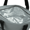 A grey cooler bag with a silver insulated interior and black handles, featuring a zip closure.