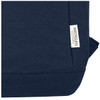 A navy blue laptop backpack with a label indicating it is made from recycled cotton.