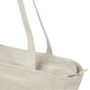 A light beige recycled zip tote with two long handles and a zip closure, featuring a logo.