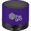 A purple cylinder Bluetooth speaker with a textured top and a logo on the side.