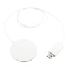 A wireless charging pad in white with a USB connector and a long cable. It features a sleek, circular design.