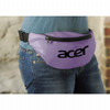 A purple bum bag worn around the waist, featuring a large logo, set against a textured background.