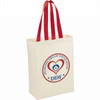 Natural cotton grocery tote in cream with red handles and a round logo featuring a heart and text.