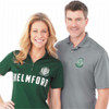 A green short sleeve polo shirt on a woman and a grey short sleeve polo shirt on a man, both with logos.