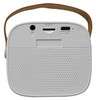 A compact white boombox mini speaker with a brown strap and various ports on the back.