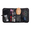 A black toiletry organizer featuring various compartments, a hairbrush, hair ties, and beauty accessories.