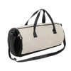 A beige and black duffle bag with dual handles and an adjustable shoulder strap. It has a zippered closure and logo.