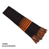 Acrylic scarf in black and orange with stripes, featuring fringed ends and a logo.