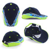 A navy blue cap with vibrant blue and lime green designs, featuring a logo and adjustable back.