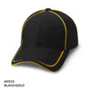 A black cap with gold piping and a logo. It features a curved brim and a structured design.