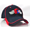 A navy cap with red accents, featuring a logo with a checkered design and an emblem on the front.