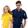 A yellow and navy polo shirt featuring white accents, worn by a male and female model. The image includes branding.