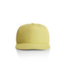 A yellow cap with a flat brim and a logo on the front, featuring ventilation holes on the top.