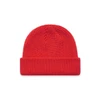 A bright red beanie with a ribbed texture and folded cuff. It features a logo on one side.