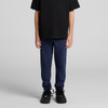 Navy track pants suitable for youth, paired with a black t-shirt and black shoes, featuring a logo on the pants.