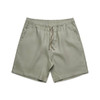 Linen shorts in a light green colour, featuring an elastic waistband and front pockets.