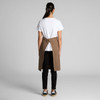 A brown canvas half apron with a tie waist, worn over a white t-shirt and black pants, featuring a back opening.