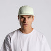 A light green nylon cap features a structured design and has a logo on the front.