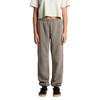 Faded track pants in grey, featuring a relaxed fit with elastic cuffs and waistband, modelled by a person.