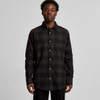 A button-up check shirt in black with a classic collar and long sleeves, featuring a front pocket and a logo.