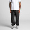 Faded track pants in dark grey, featuring an elastic waistband and cuffed ankles, worn with a white t-shirt.