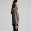 A faded grey half-zip jacket featuring a high collar, showcased on a model from the side.
