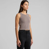 A cropped rib tank top in a muted grey colour, paired with black jeans. The top features a subtle logo.