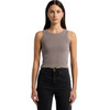A model wearing a faded organic rib crop tank in a muted grey colour, paired with black high-waisted jeans.