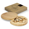 A round bamboo cheese board with three cheese knives, displayed in a cardboard box with a logo.