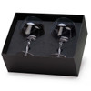 A glass set in a black box containing two stemmed glasses, showcasing a clear design with a sleek finish.