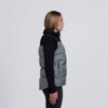 A side view of a grey and black smpli Axle Puffa Vest with a zippered pocket and a logo.