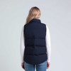A navy puffa vest viewed from the back, featuring a sleeveless design and a simple silhouette.