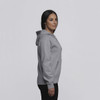 A grey women's vintage hoodie with a front pocket and a hood, displayed on a model from the side.
