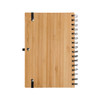 A bamboo-covered spiral A5 notebook with a metal spiral binding and elastic closure.
