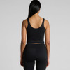 A black active bra tank featuring a fitted design and wide straps, shown from the back.