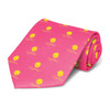 A pink tie featuring a repeated yellow pattern and a logo. The tie is neatly rolled for presentation.
