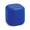 A blue lip balm container with a rounded square shape and a logo on the front.